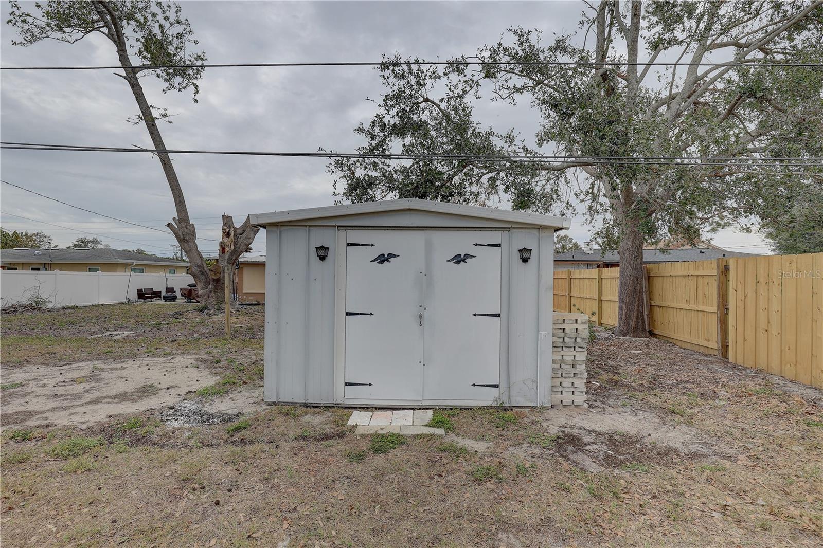 Storage Shed (neighbor's fence came down during the storm)