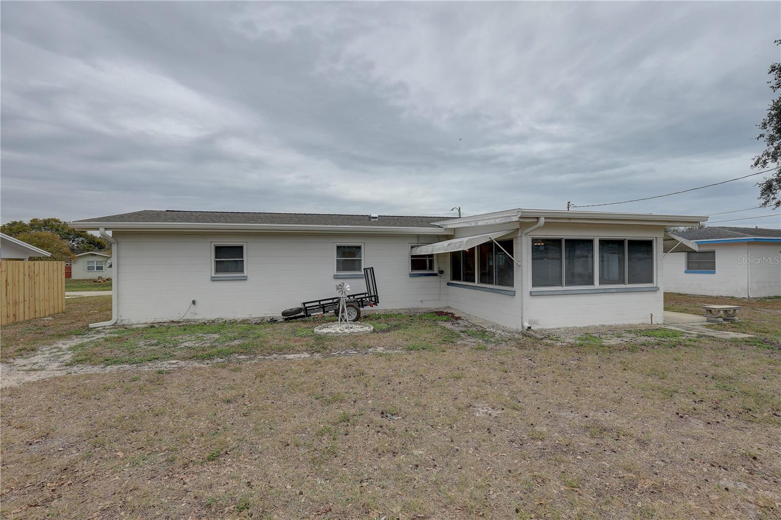 Rear of the home with large yard