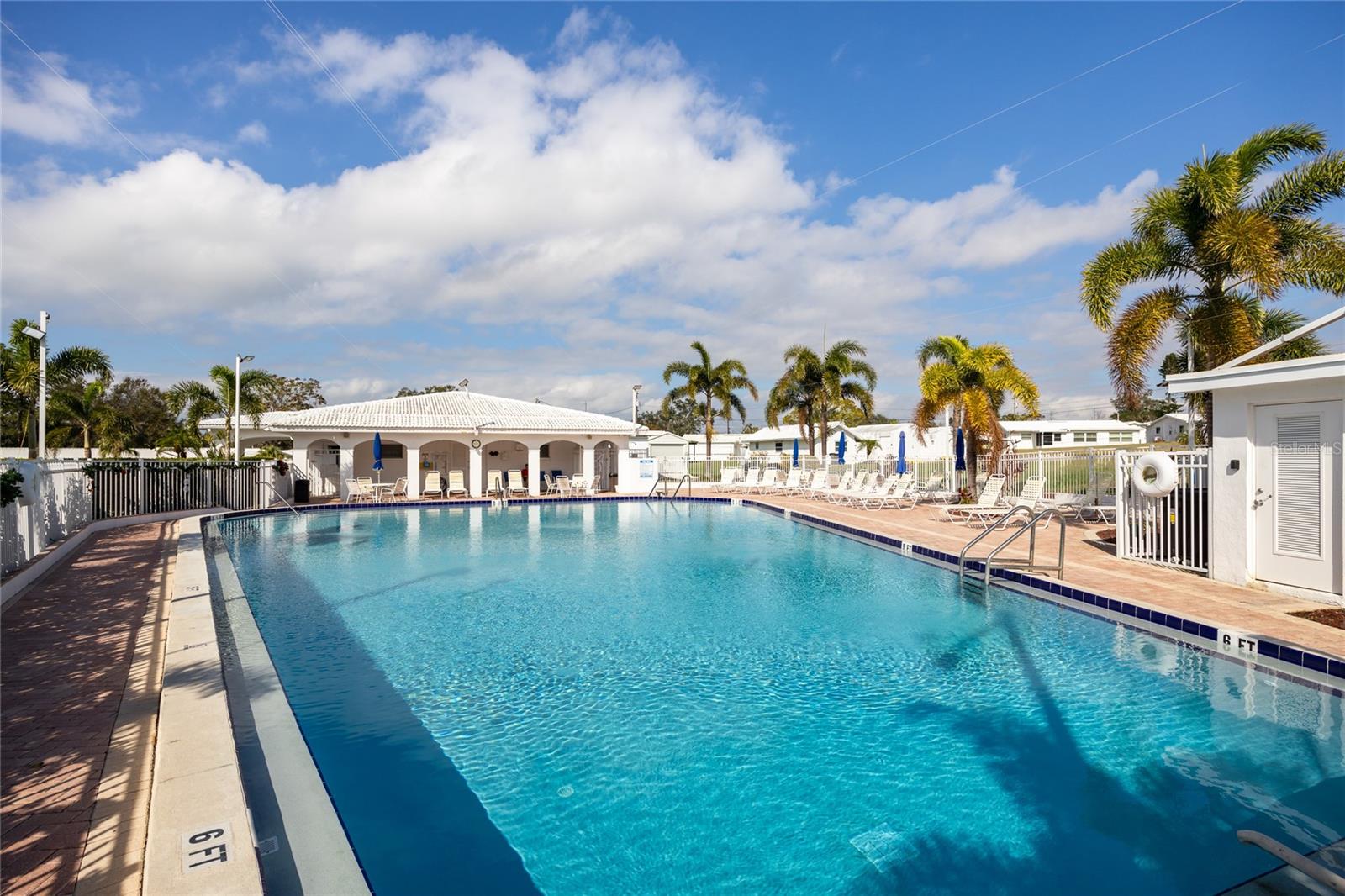 A large pool with plenty of sundeck awaits!