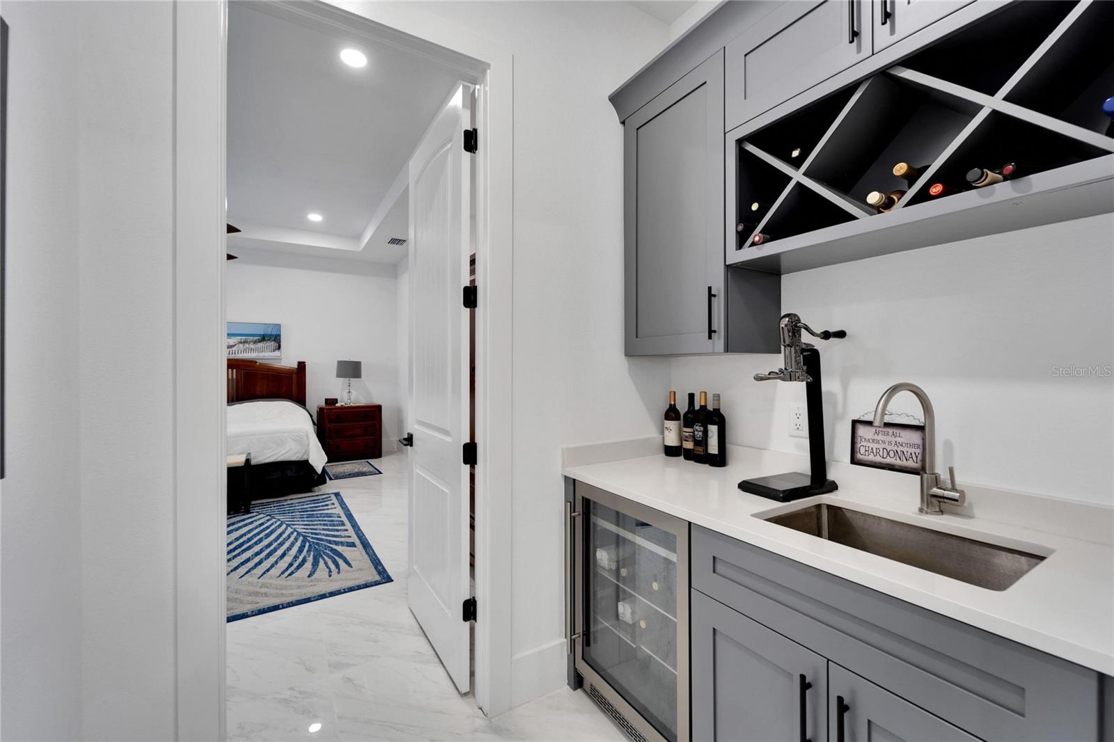 Wet Bar with wine refrigerator off of kitchen