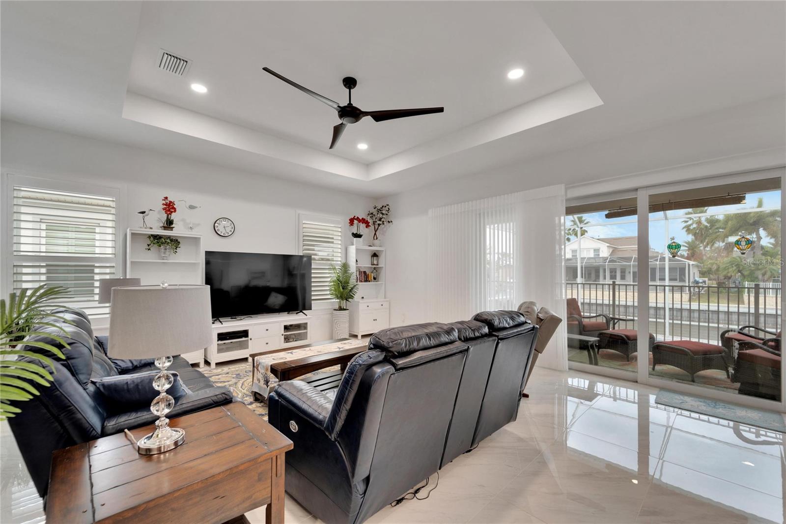 Family Room with access to lanai and pool