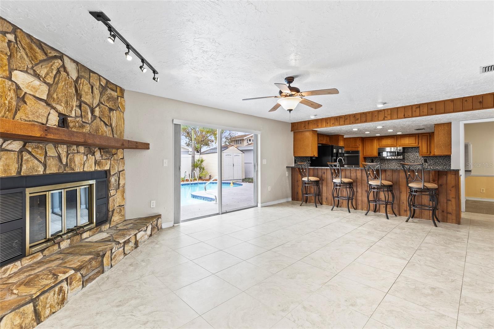 Family room with slider to pool