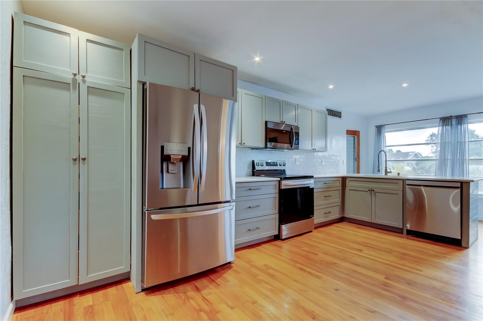 Spacious kitchen with mostly new stainless steel appliances