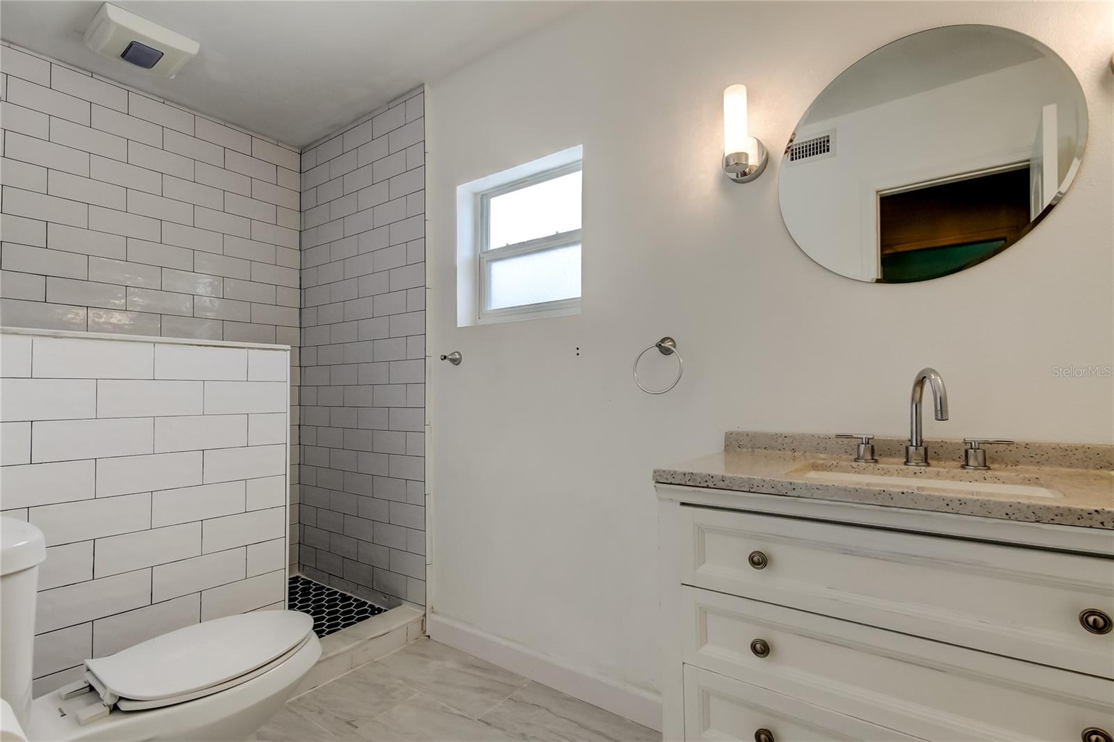 Master bath with shower and newer vanity