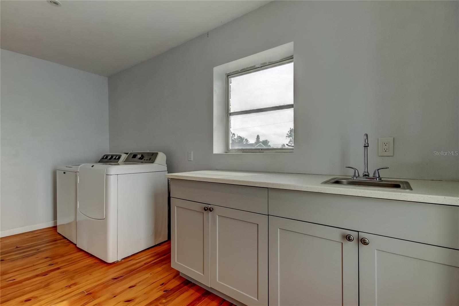 Laundry Room has full size washer and dryer, quartz countertops