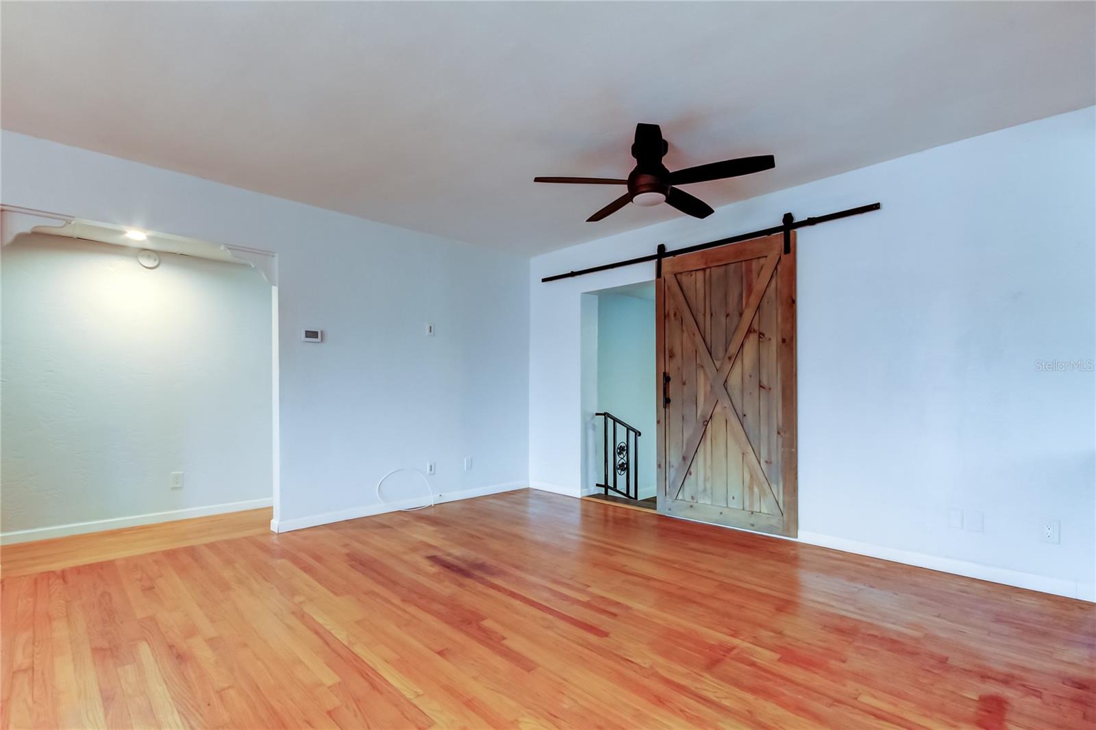 From hallway on left of photo, go through Barn Door to the Bonus Room