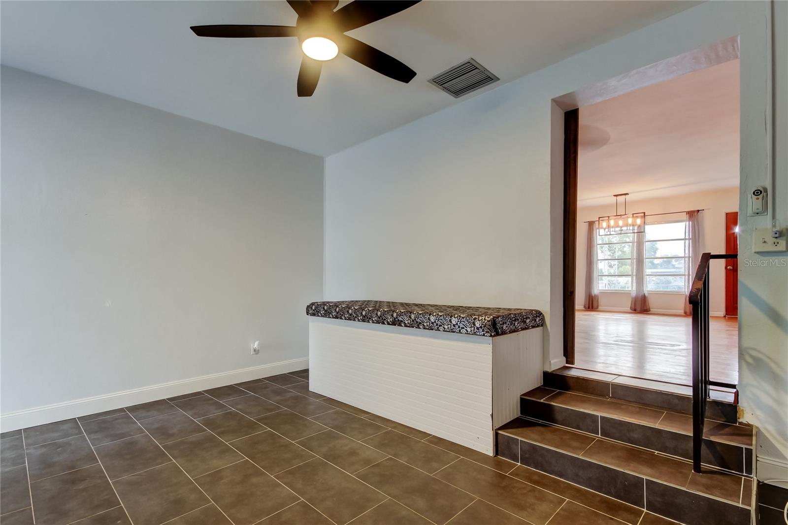 Bonus Room has ceiling fan and tile floor.