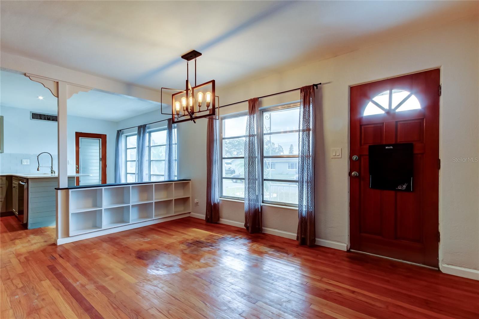 Dining area could be where the chandelier is located