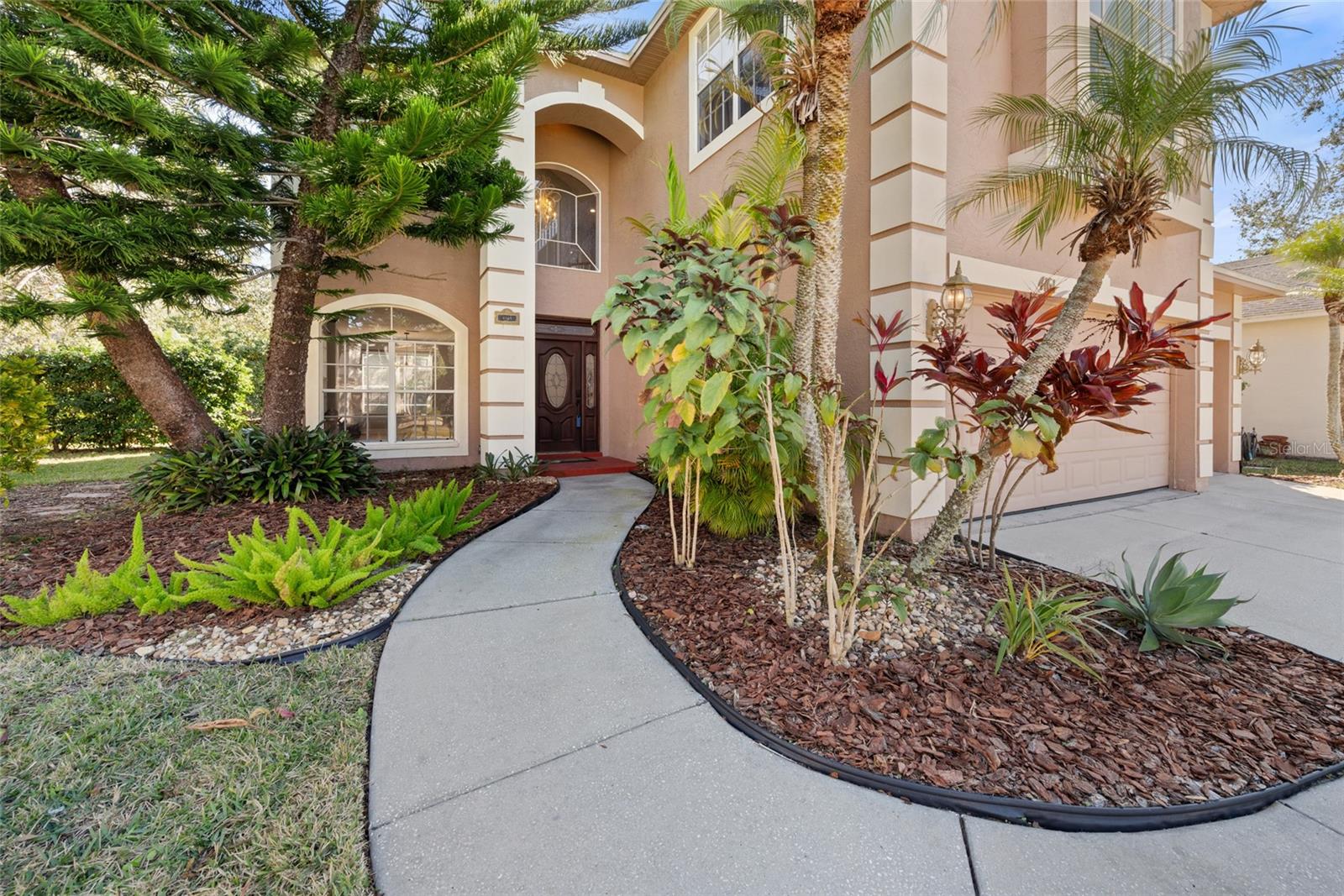 FRONT ENTRANCE AND FAMILY ROOM