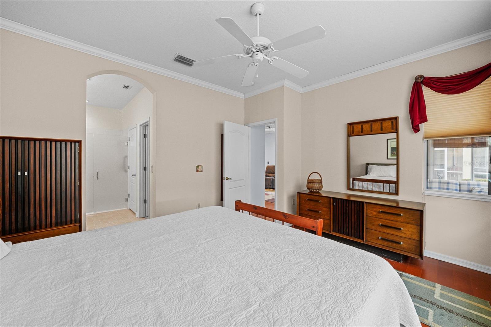 ensuite bathroom with double sinks and walk in shower