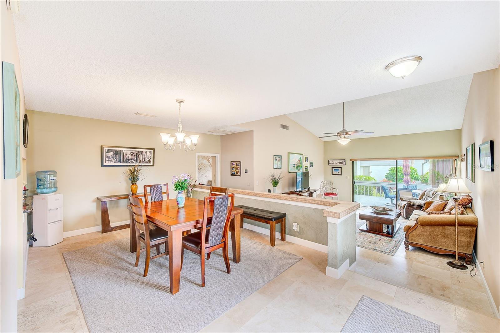 Dining area with kitchen off to the left  Primary Bedroom entrance on right