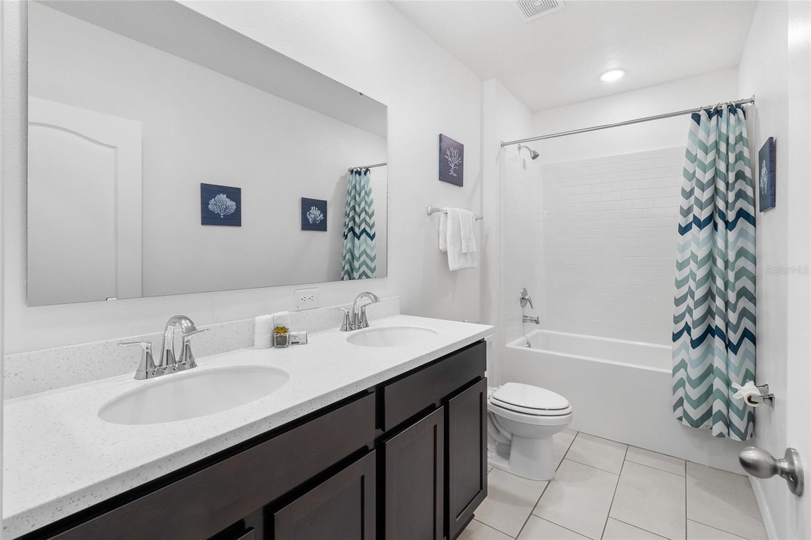 bathroom#2 Inviting subway tile & dual sink Quartz vanity