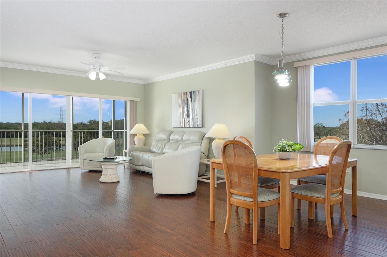 Wow! This is a Corner Unit with a split bedroom plan. Look at the Engineer's hardwood floors and crown molding. It's light and Bright, and it has views!