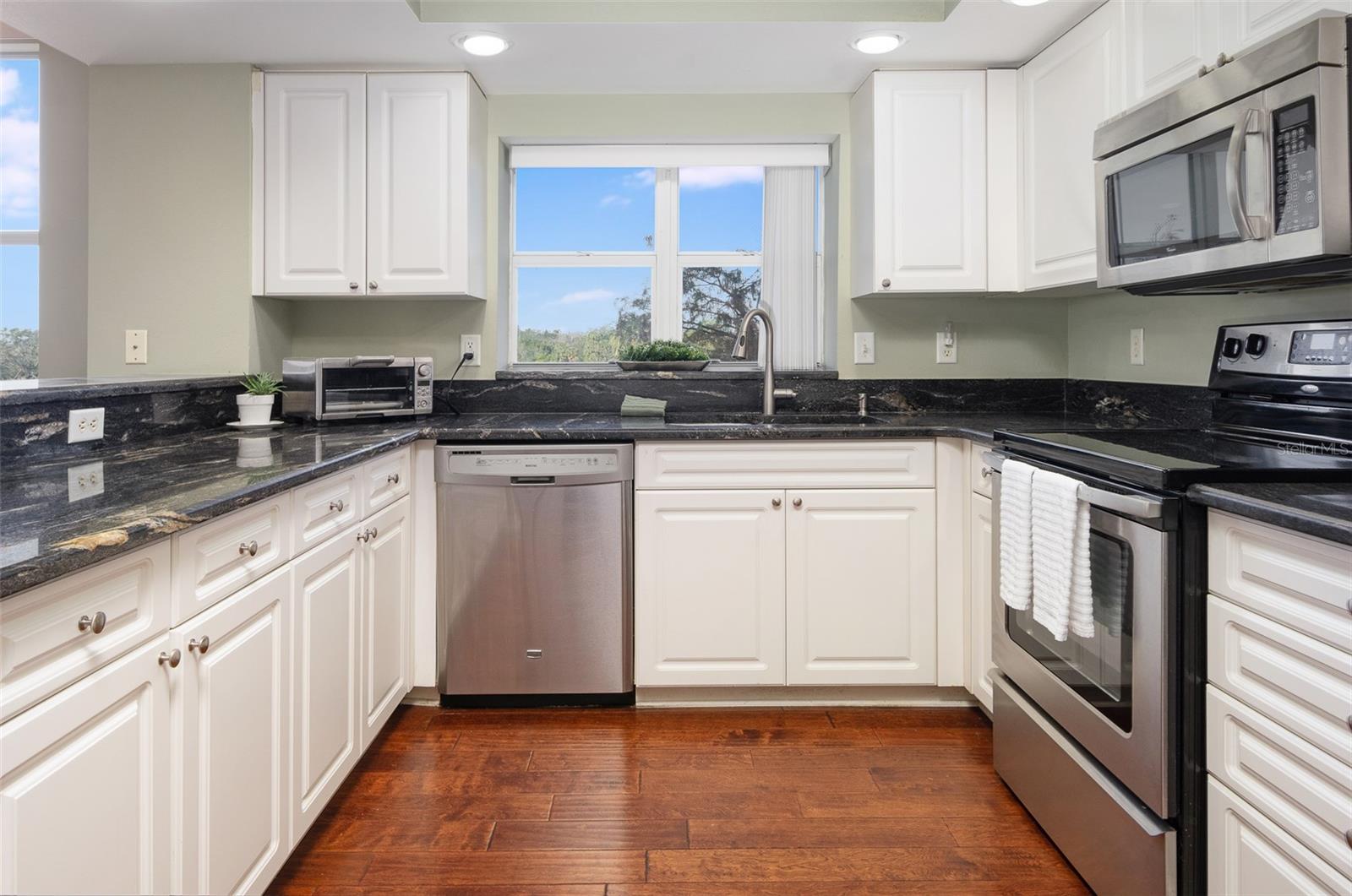 A sleek, functional, spacious kitchen with a window, too!