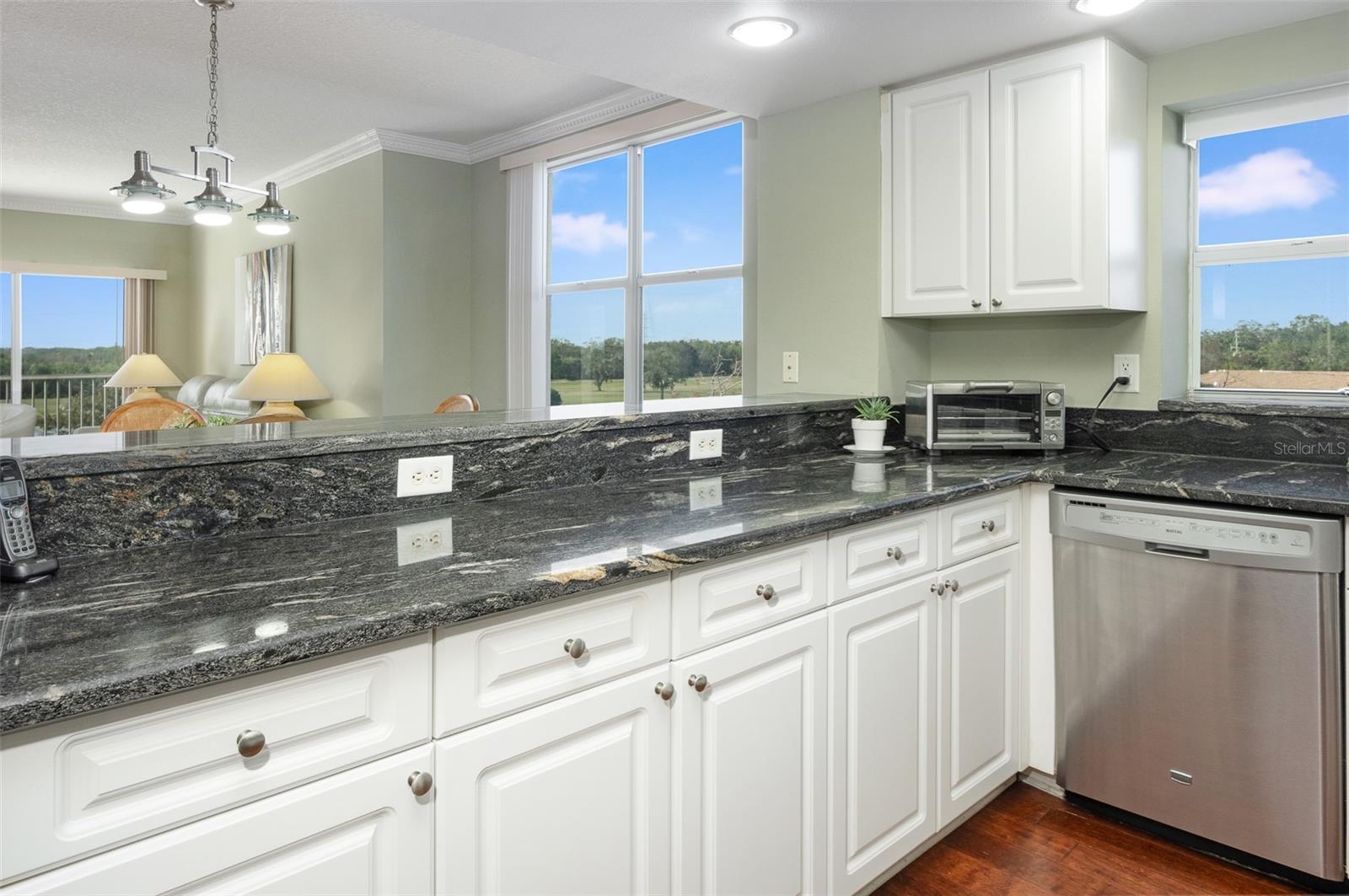 Entertaining is easy with this open kitchen and passthrough!