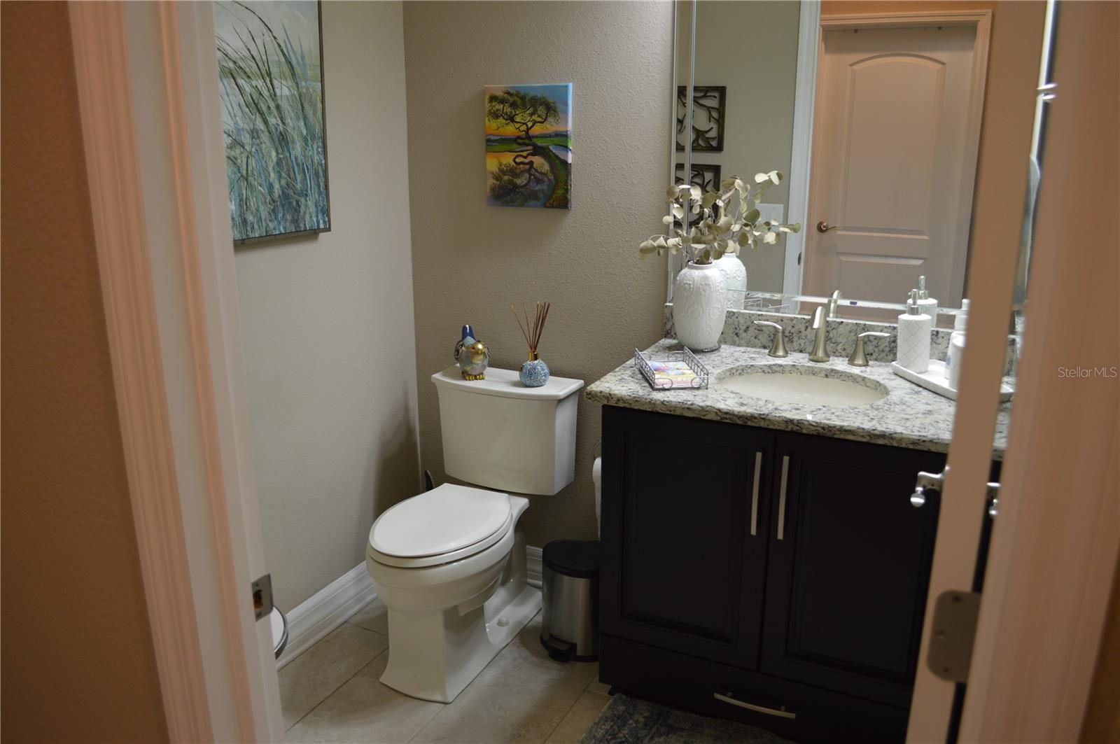 Half bath in the hallway towards the laundry and garage.