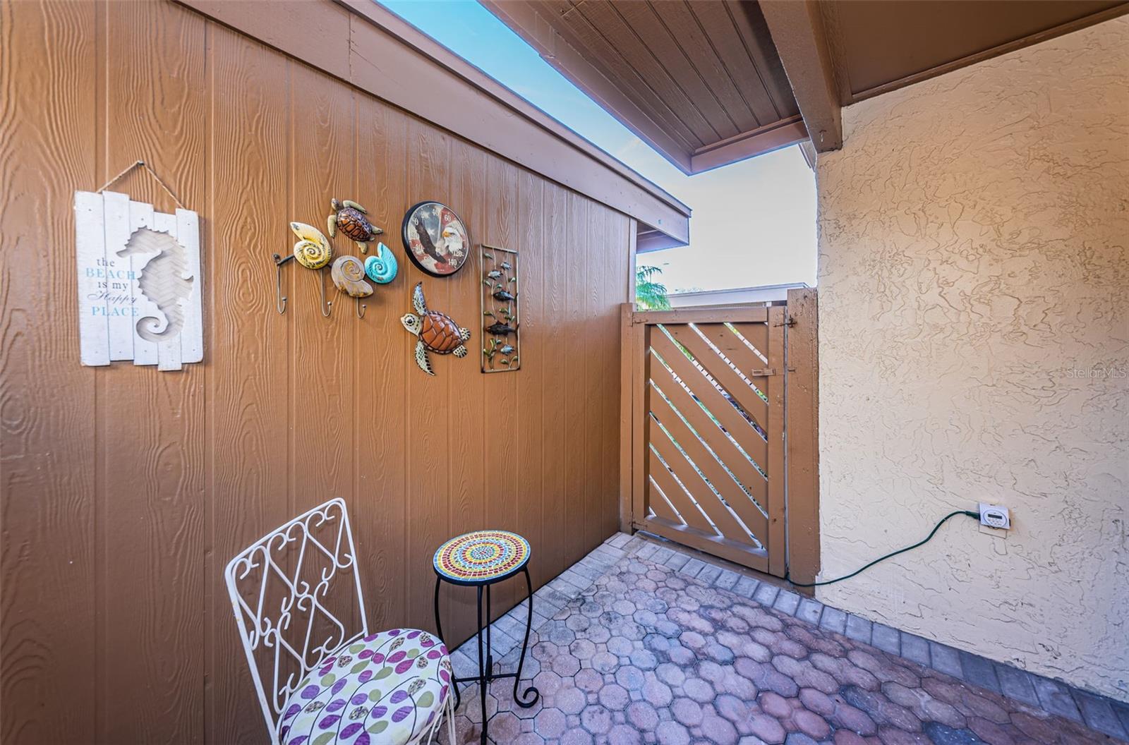 Front Lanai - Gate to carport & storge closet