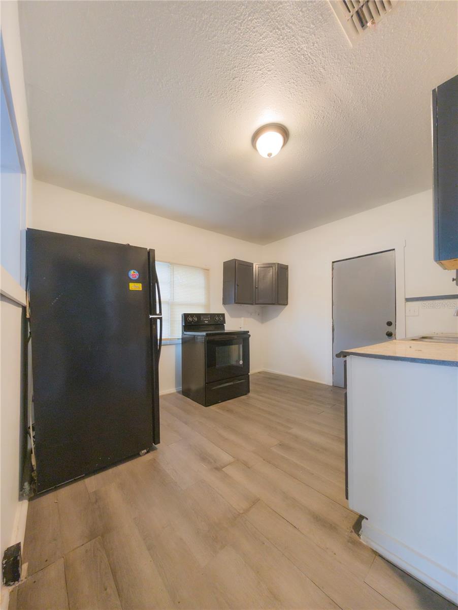 Fridge and stove in kitchen