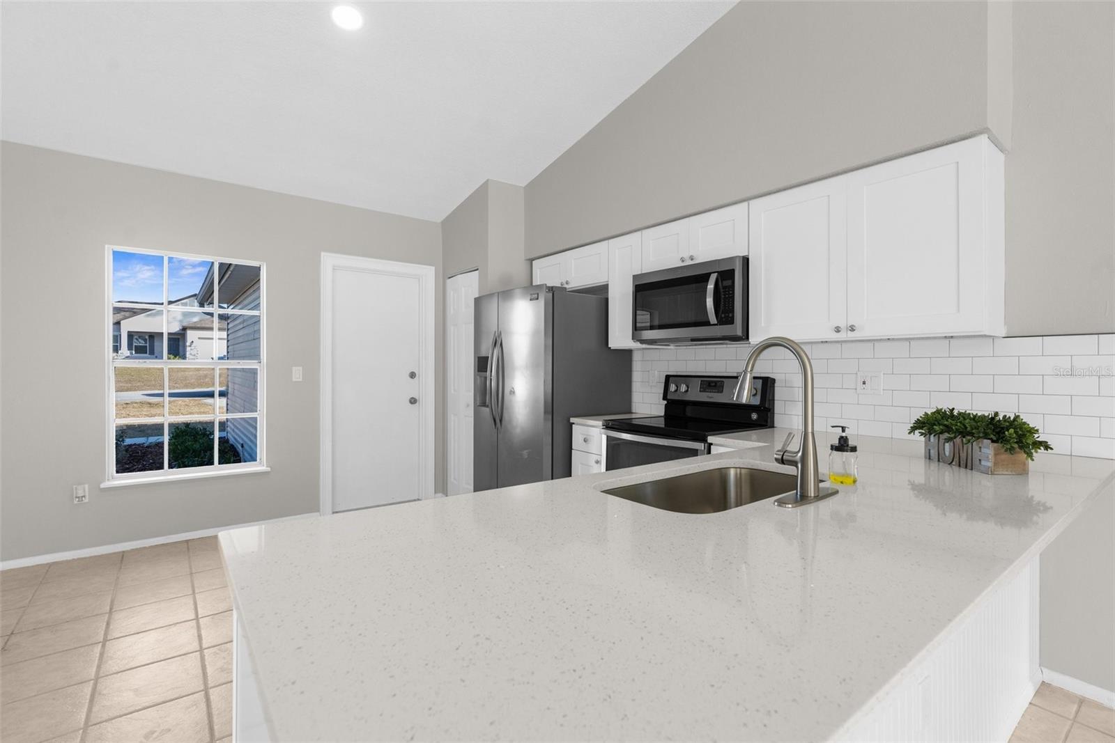 Quartz countertops and large breakfast bar!