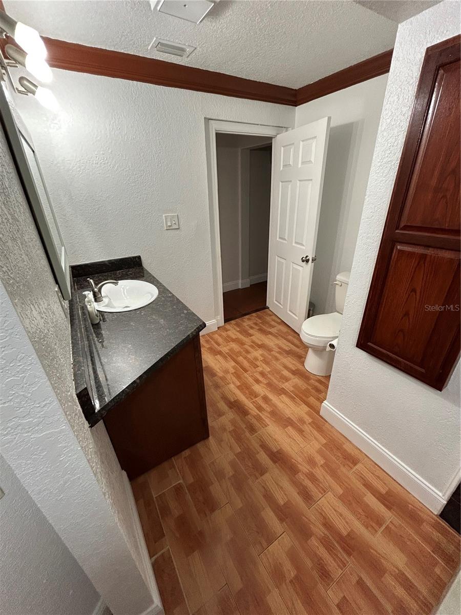 First Level Bathroom off Kitchen area w/ washer dryer hook-up