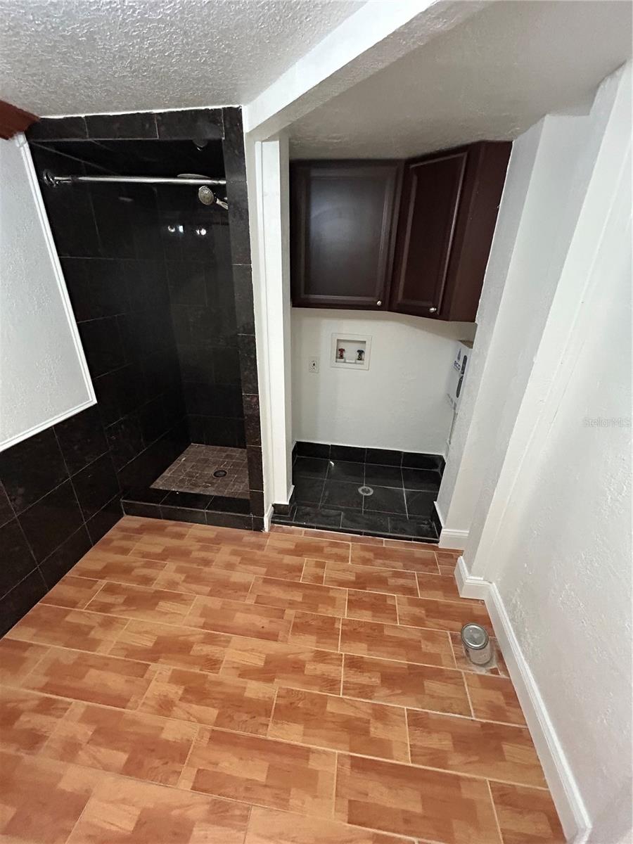 First Level Bathroom off Kitchen area w/ washer dryer hook-up