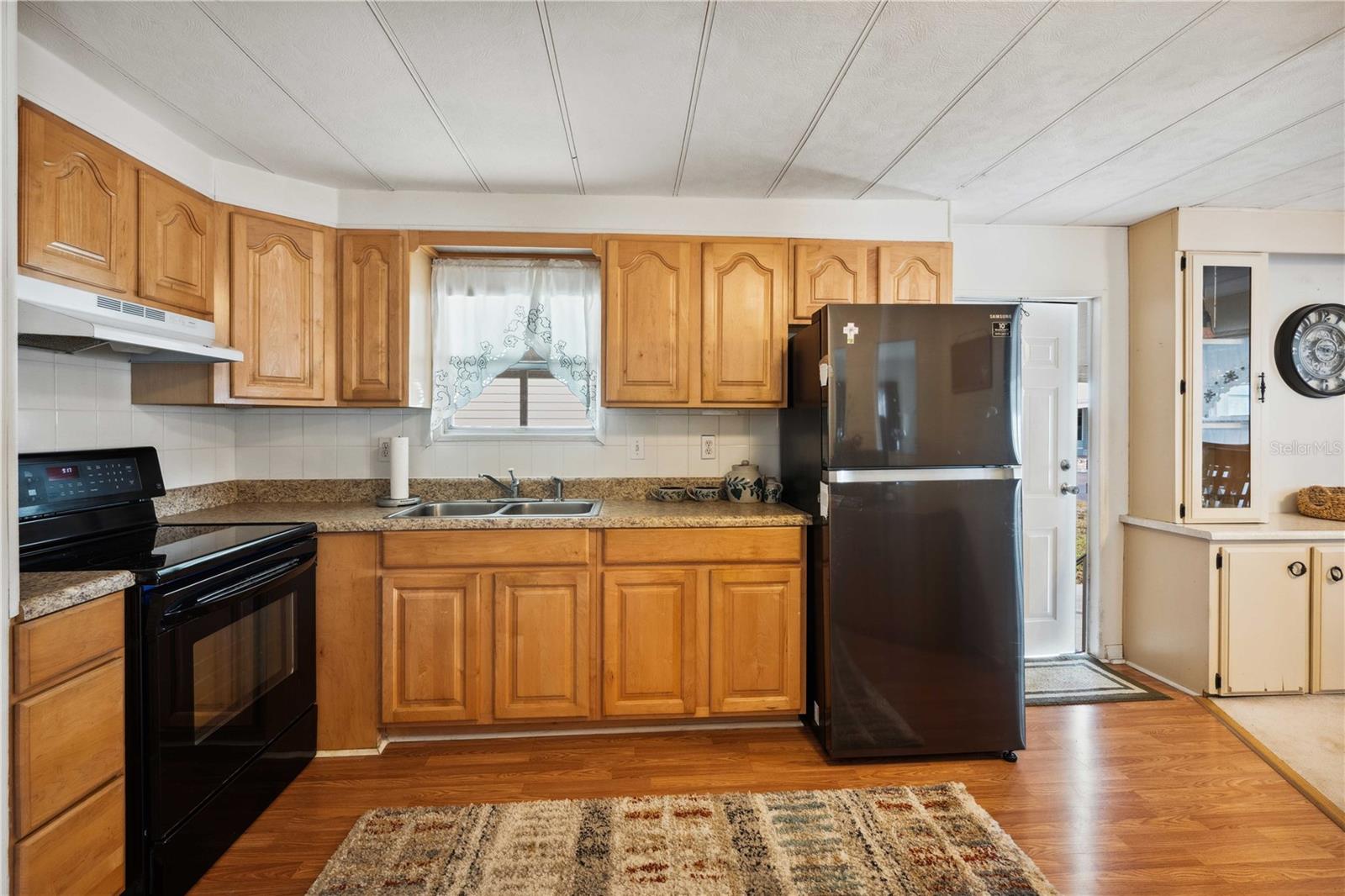 With updated appliances and laminate floors