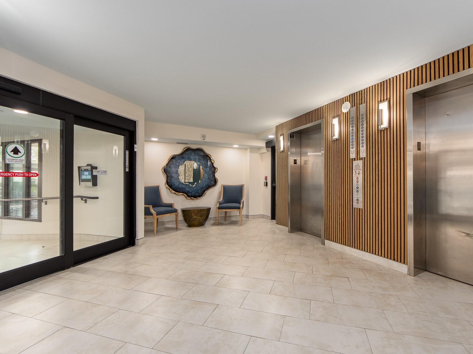 Newly remodeled lobby including hurricane impact doors and windows