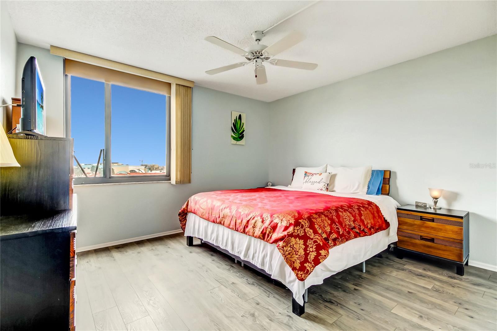 King-sized bedroom, with walk-in closet and water views.