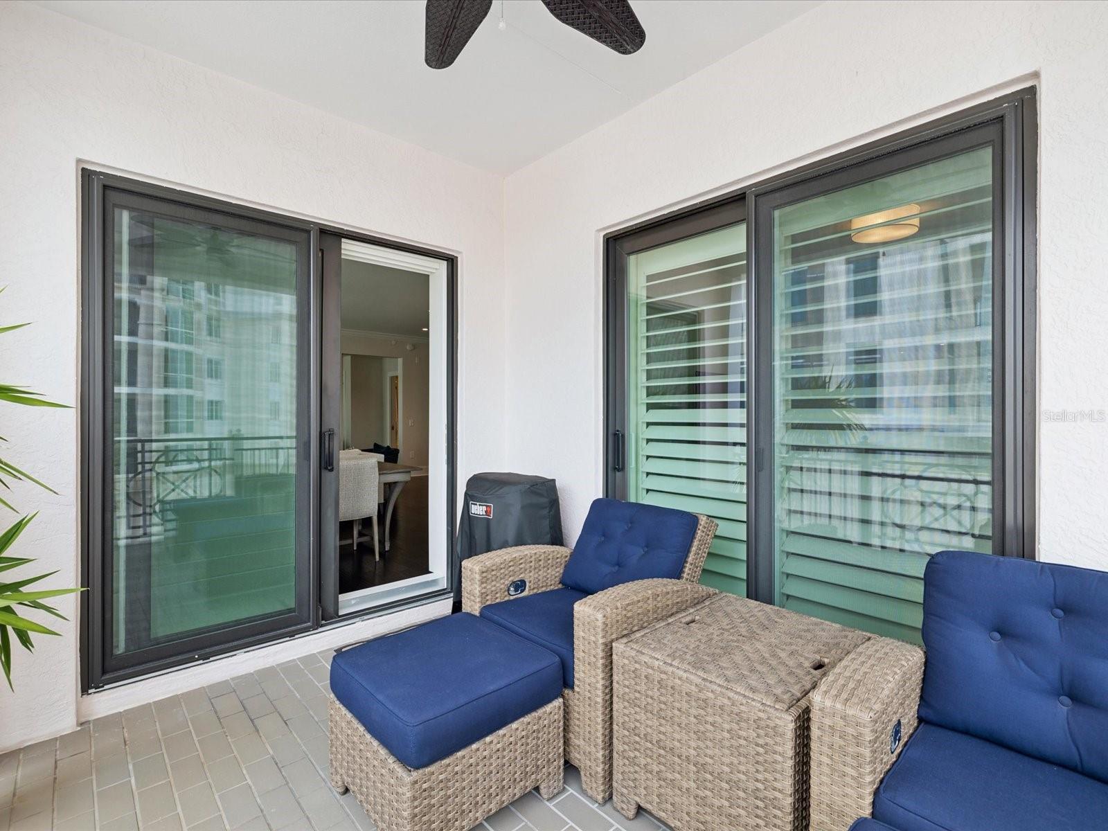 Sliding doors leading from dining area and primary bedroom to the balcony