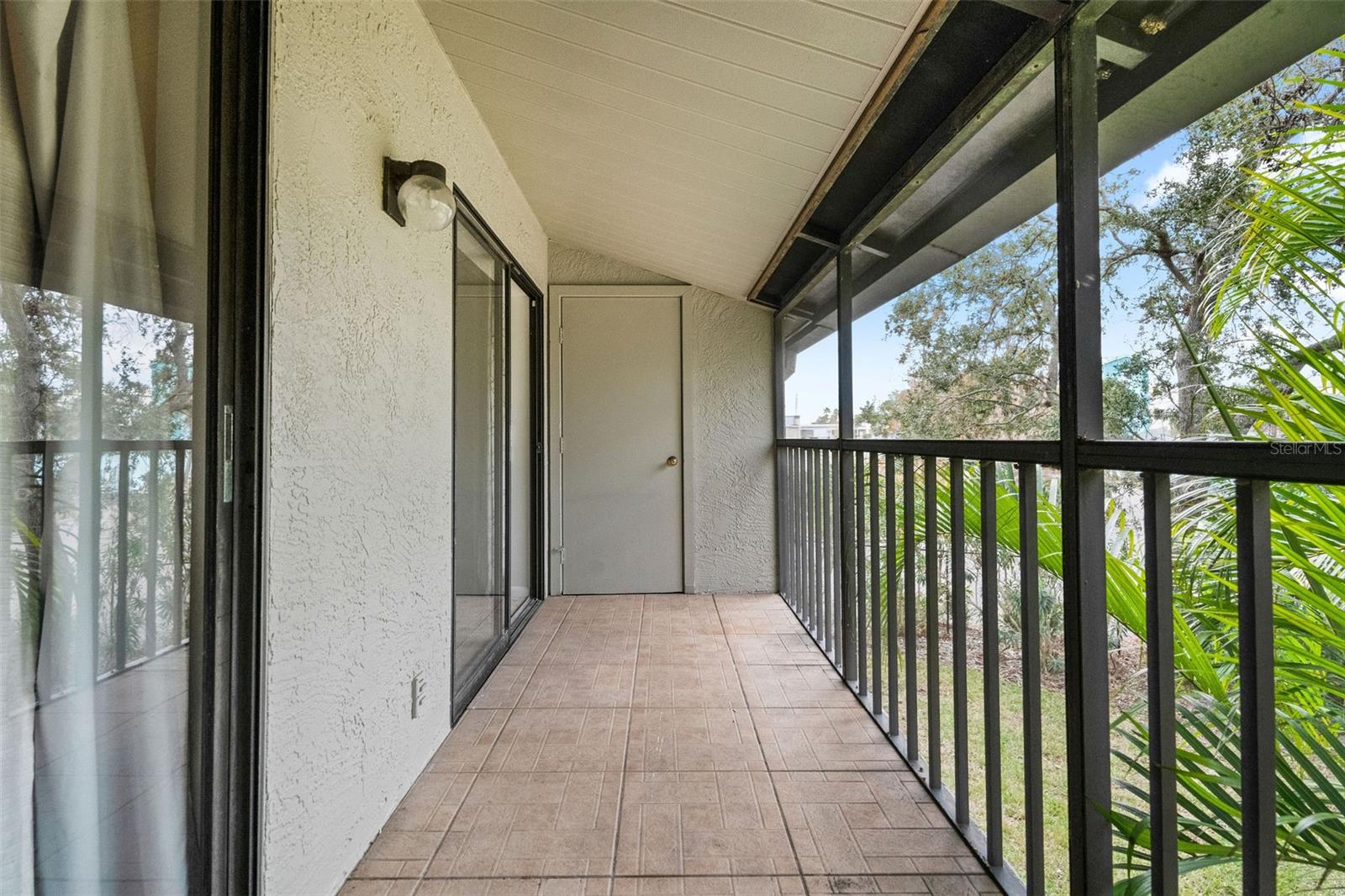 Screened Rear Balcony Living area to Master Bedroom