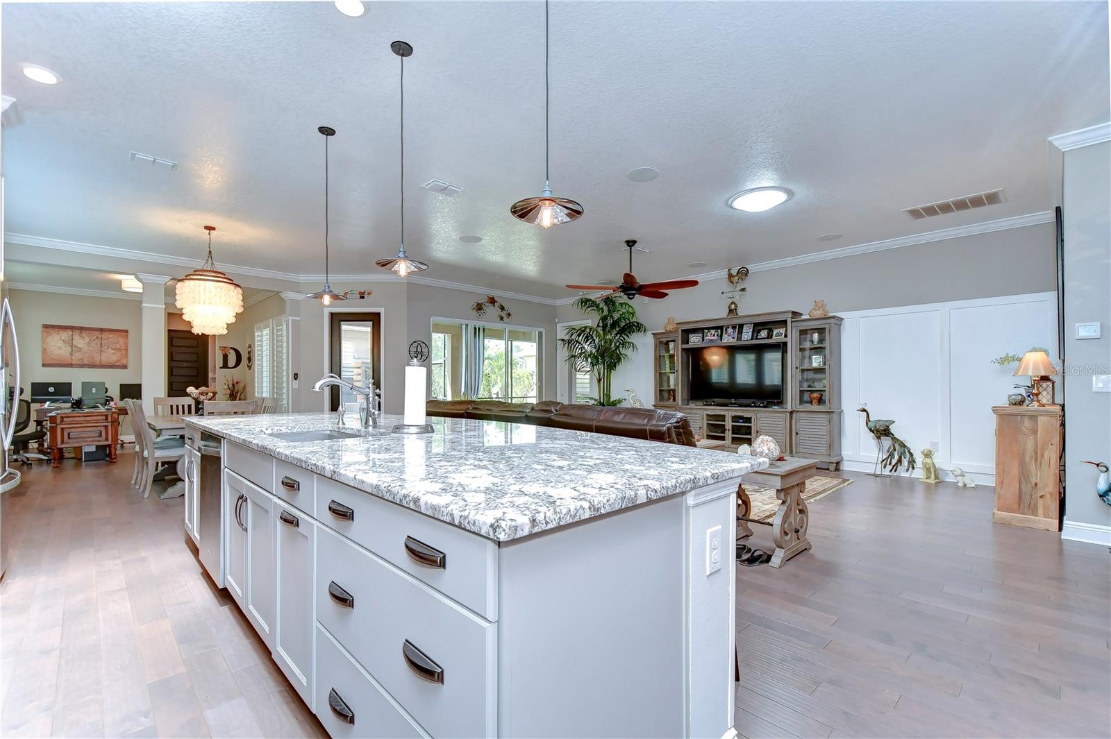 Kitchen flows seamlessly into family room, making entertaining a breeze!