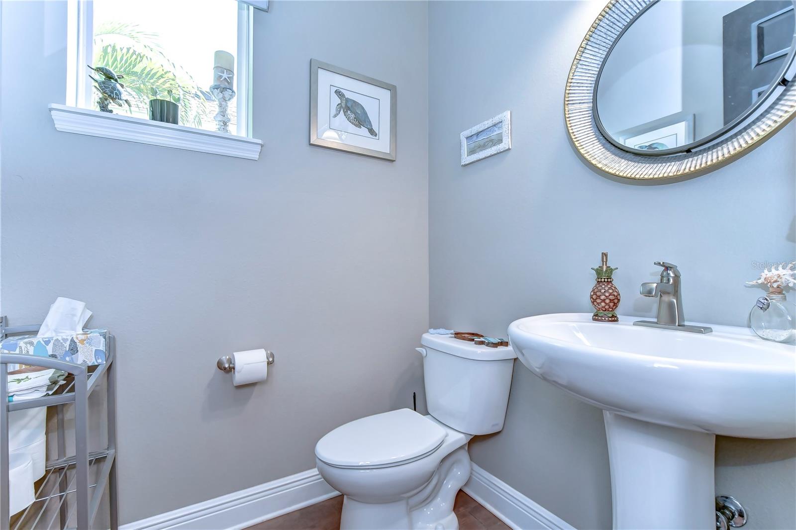 Half bathroom with lots of natural lighting!