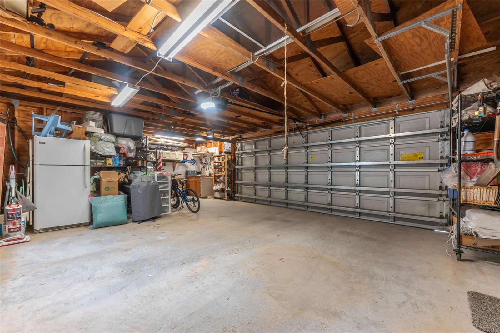 2 car garage with expanded work space.  New garage door rated up to 180/mph