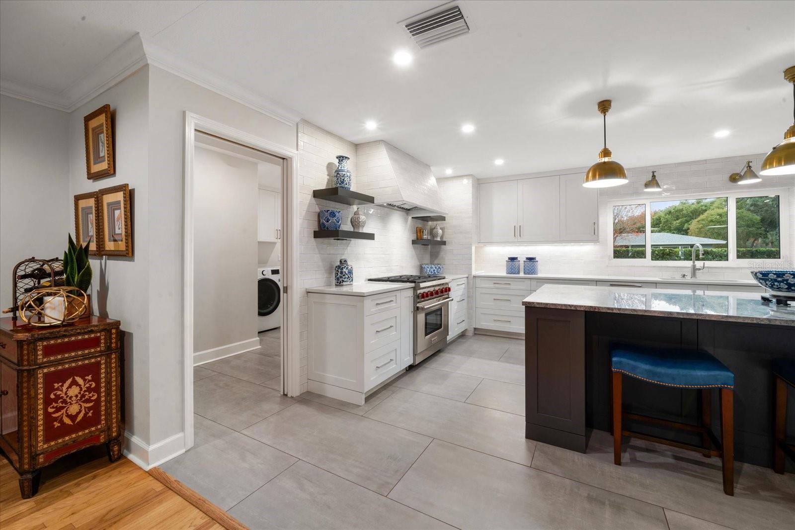 Spacious kitchen flows seamlessly to family room area and laundry.