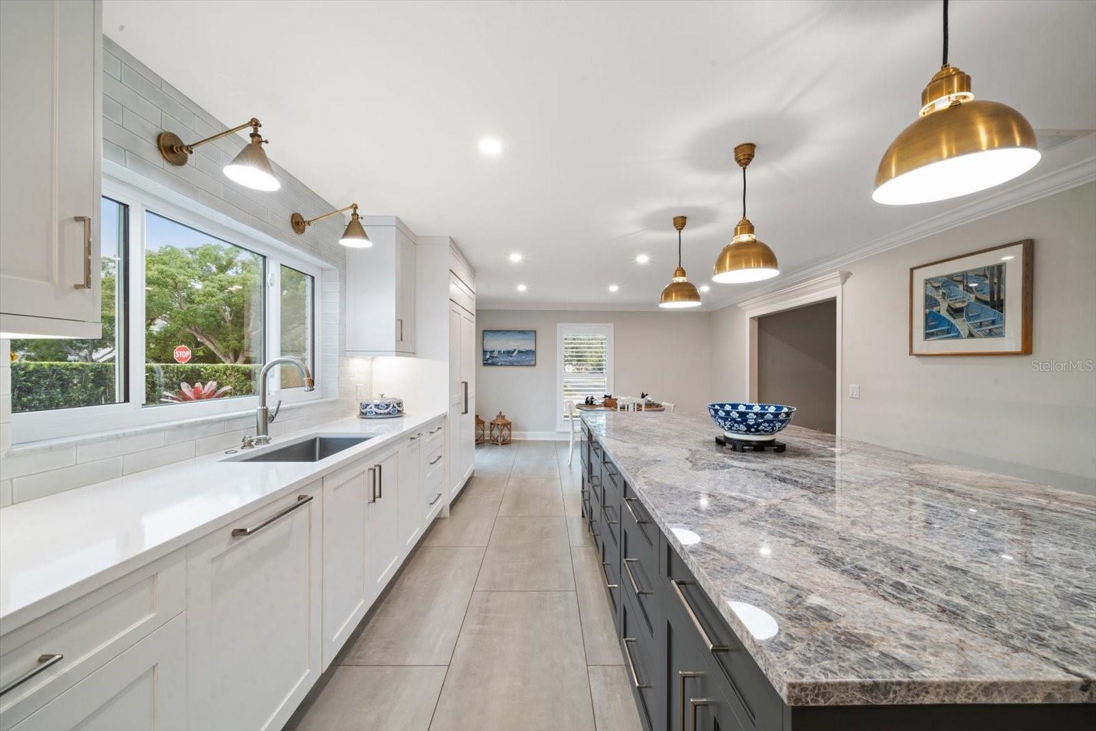 Exquisite in details, the Quartz counters are stunning as are the details found everywhere in this impressive kitchen.