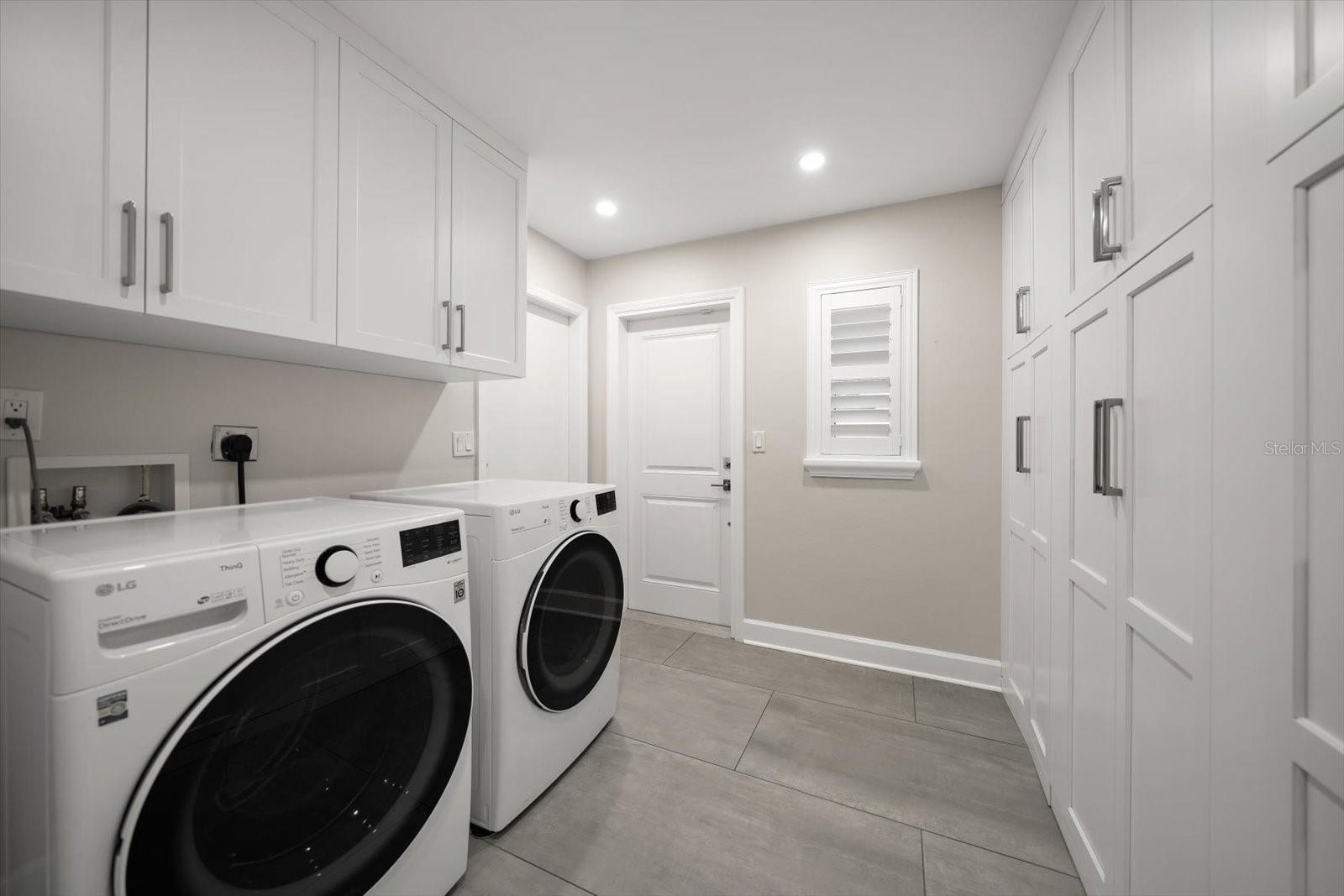 Laundry room with extensive storage