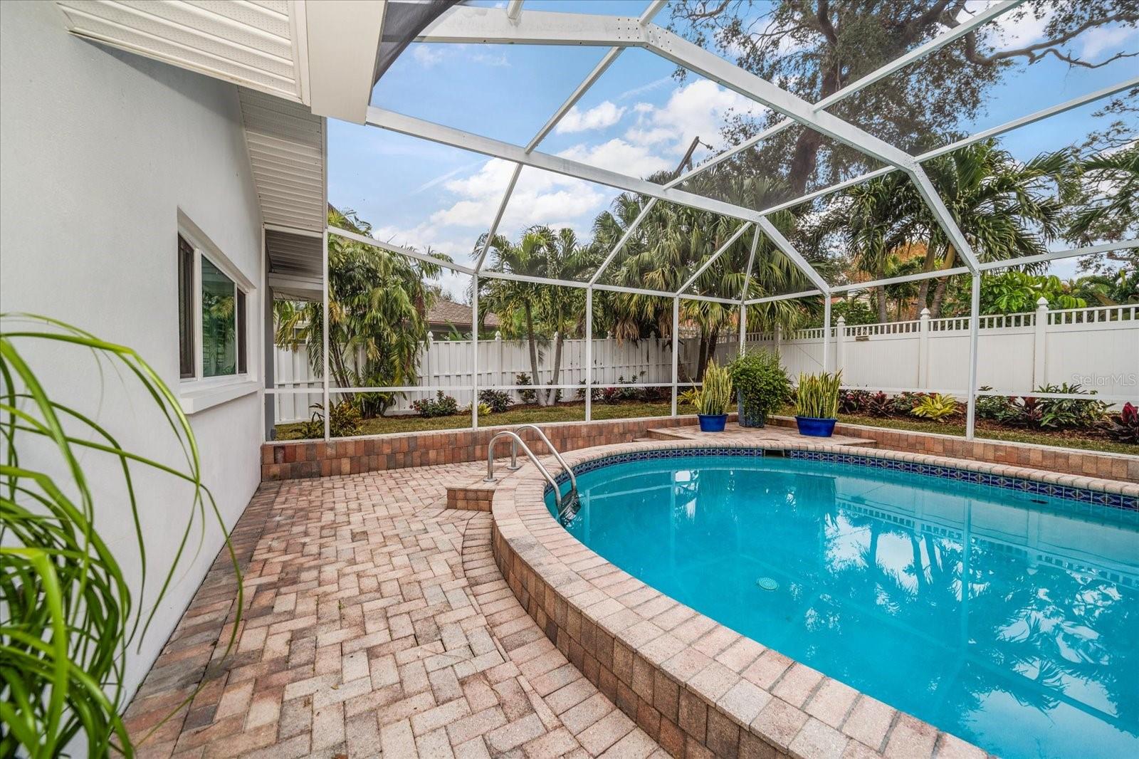 Fully fenced yard with fresh attractive landscaping