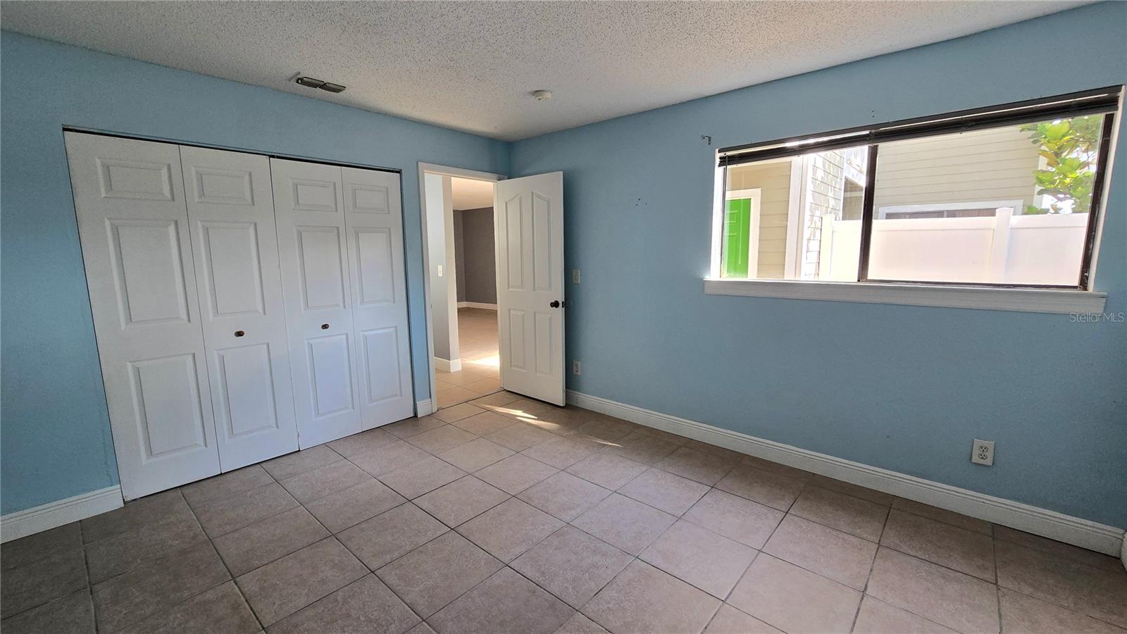 Another view of the bedroom with a large closet for great storage