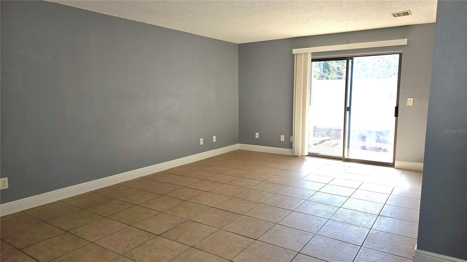 Living Room.  Sliding door takes you to the fenced Courtyard private patio