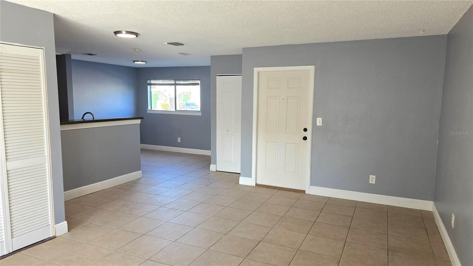 View of the living room from the back sliding door.