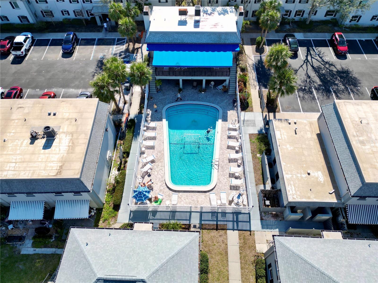 Heated pool next to laundry and clubhouse.