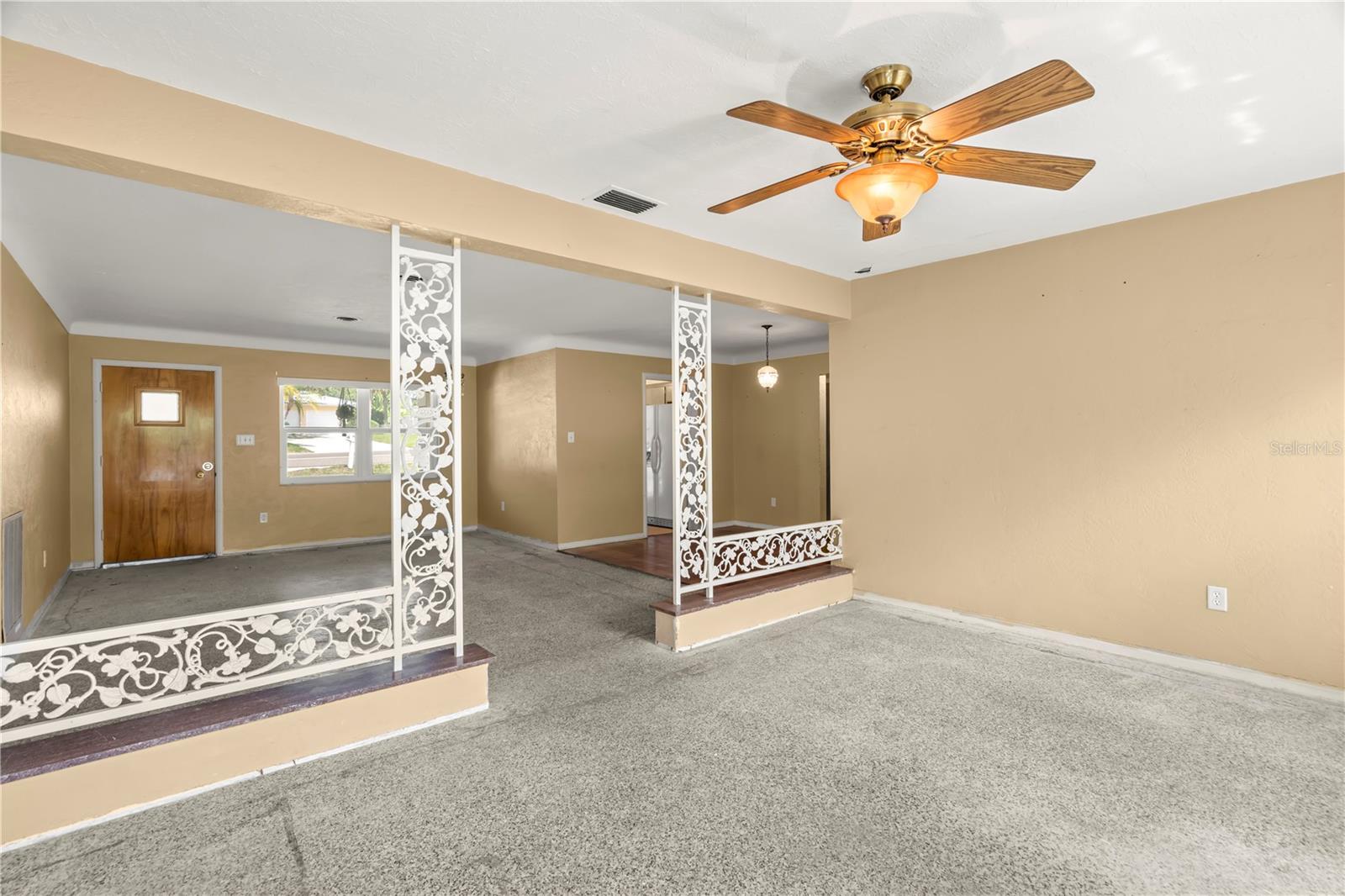 Family Room/ Bonus Room with ceiling fan- could be used for additional living space, office space, larger dining room, art studio - the possibilities are endless!