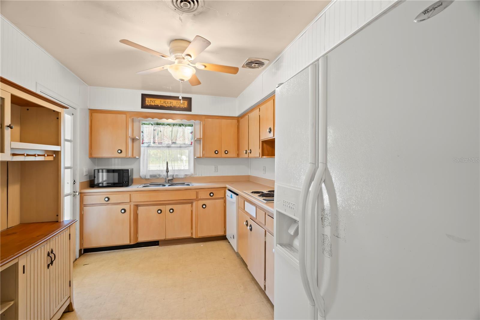 Side by side fridge with water and ice dispenser