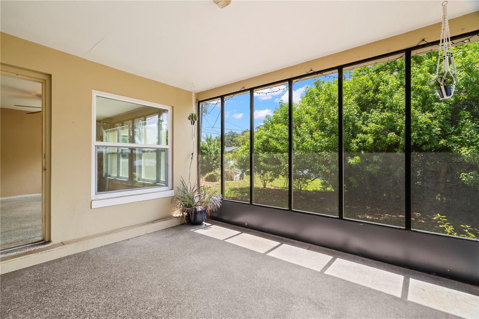 Family Room opens to the screened lanai with access to the backyard