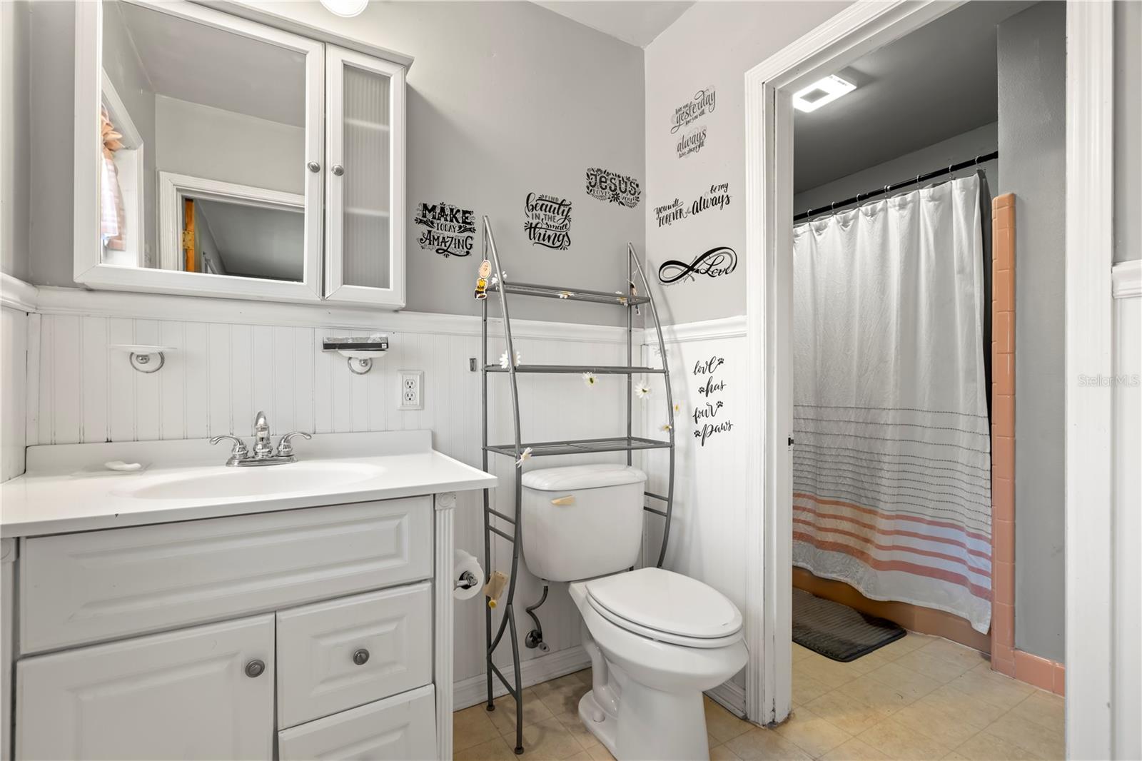 Updated En suite master bath with wainscoting on walls