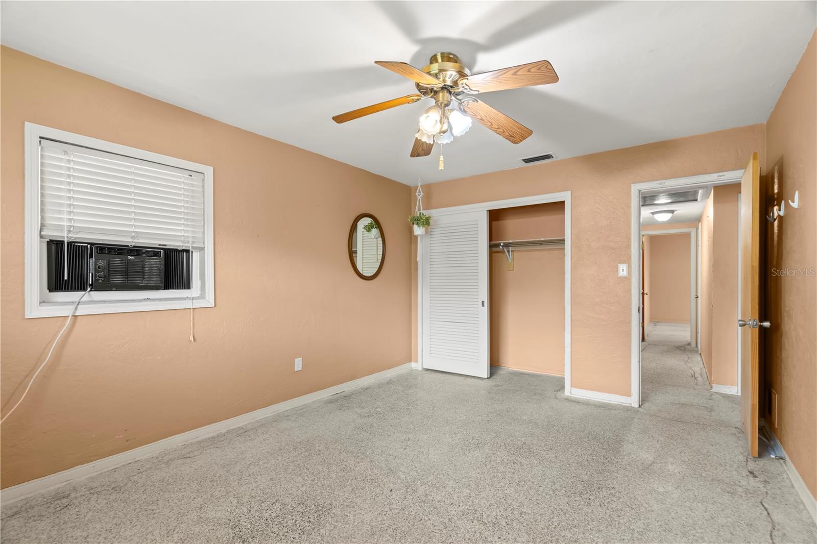 3rd bedroom has ceiling fan. Carpets have been ripped up so you can install your own flooring or leave the terrazzo underneath