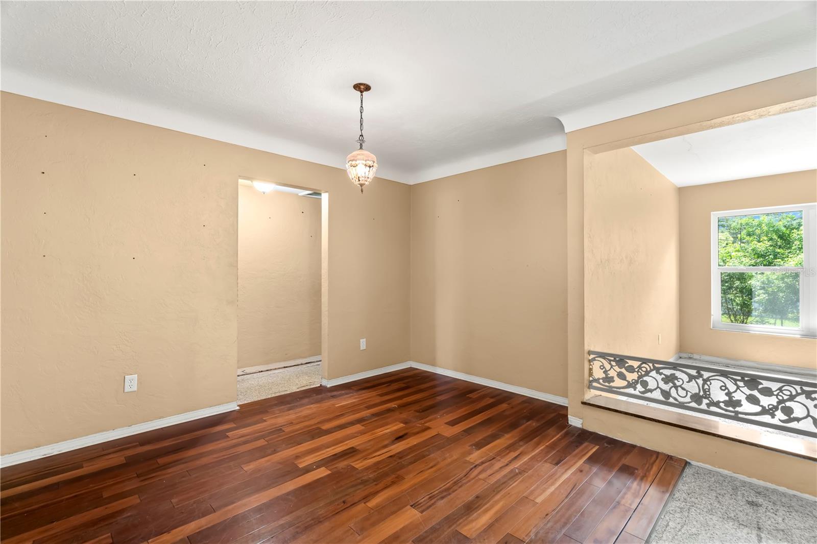 Dining Room with COVED CEILINGS and Engineered Hardwood Flooring