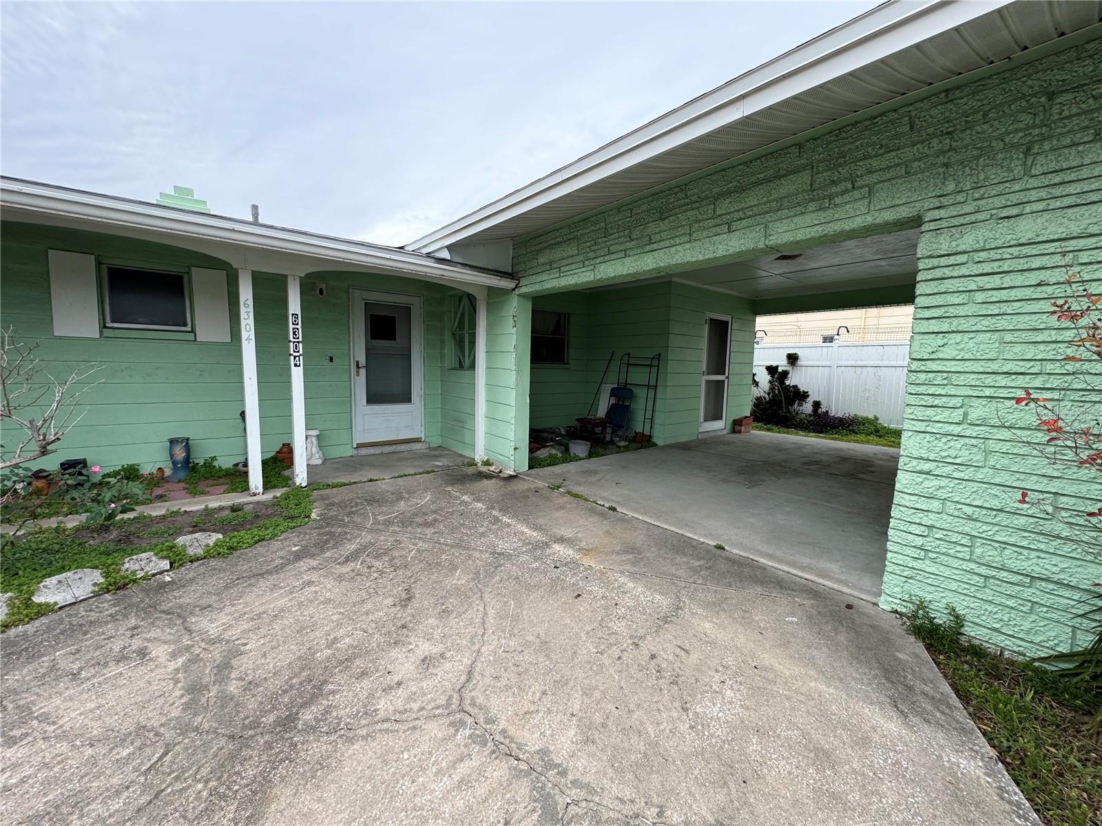 Carport with storage shed