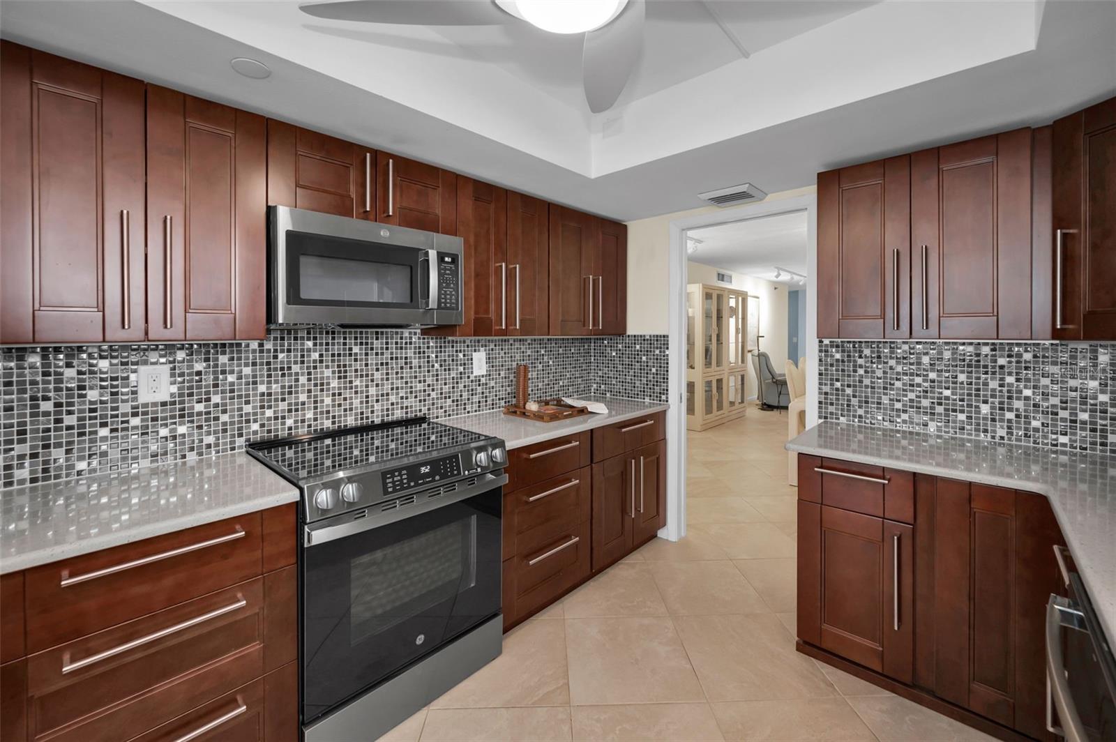 Beautiful Granite Counters, Tile Backsplash, Cherry cabinets & more!