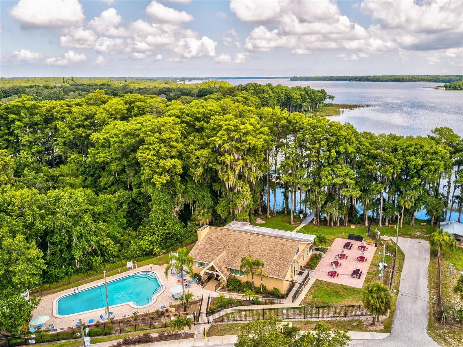 Geothermal-heated pool and pool deck with a nearby certified butterfly garden, a patio, picnic tables and grills as well as a horseshoe pitching pit.